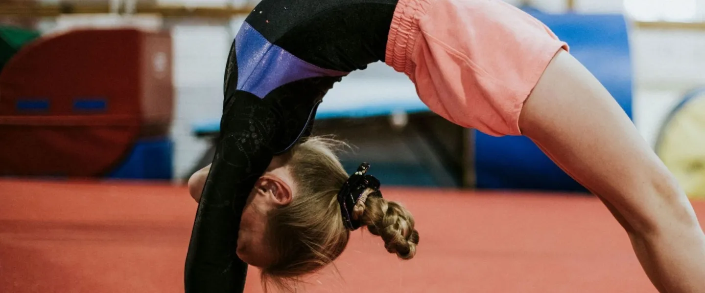 Young girl doing a backbend at the YMCA