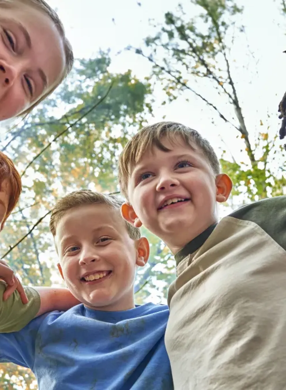 A group of children gathered together, sharing a joyful moment