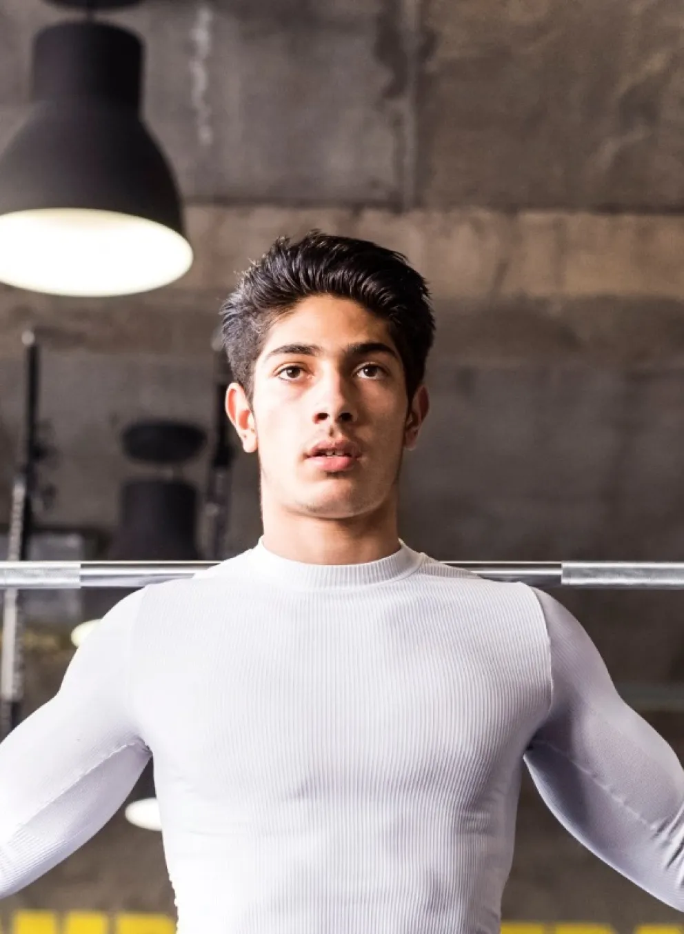 Teen Squatting Lifting Weights